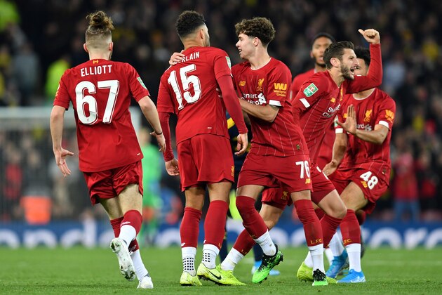 Liverpool's English midfielder Alex Oxlade-Chamberlain (2L) celebrates scoring his team's third goal during the English League Cup fourth round football match between Liverpool and Arsenal at Anfield in Liverpool, north west England on October 30, 2019. (Photo by Paul ELLIS / AFP) / RESTRICTED TO EDITORIAL USE. No use with unauthorized audio, video, data, fixture lists, club/league logos or 'live' services. Online in-match use limited to 75 images, no video emulation. No use in betting, games or single club/league/player publications. /  (Photo by PAUL ELLIS/AFP via Getty Images)