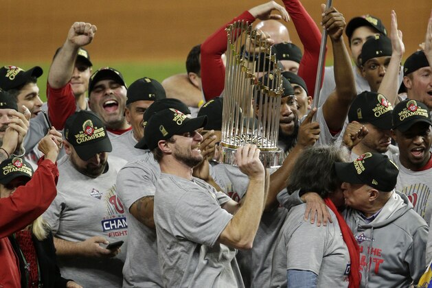 HOUSTON, TEXAS - OCTOBER 30:  Max Scherzer #31 of the Washington Nationals holds the Commissioners Trophy after defeating the Houston Astros 6-2 in Game Seven to win the 2019 World Series in Game Seven of the 2019 World Series at Minute Maid Park on October 30, 2019 in Houston, Texas. (Photo by Bob Levey/Getty Images)