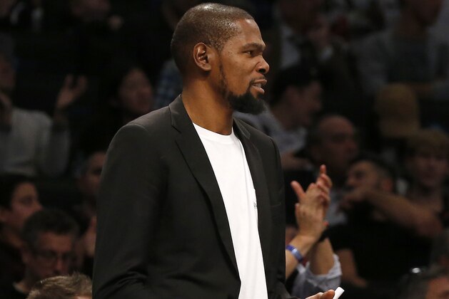 NEW YORK, NEW YORK - OCTOBER 23:   (NEW YORK DAILIES OUT)   Kevin Durant #7 of the Brooklyn Nets looks on from the bench during a game against the Minnesota Timberwolves at Barclays Center on October 23, 2019 in New York City. (Photo by Jim McIsaac/Getty Images)