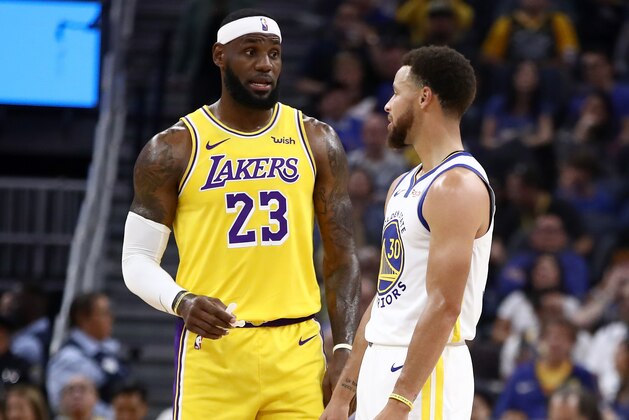 SAN FRANCISCO, CALIFORNIA - OCTOBER 05:  LeBron James #23 of the Los Angeles Lakers talks to Stephen Curry #30 of the Golden State Warriors during their game at Chase Center on October 05, 2019 in San Francisco, California.  NOTE TO USER: User expressly acknowledges and agrees that, by downloading and or using this photograph, User is consenting to the terms and conditions of the Getty Images License Agreement.  (Photo by Ezra Shaw/Getty Images)