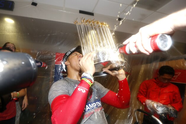 HOUSTON, TEXAS - OCTOBER 30:  Juan Soto #22 of the Washington Nationals celebrates in the locker room after defeating the Houston Astros in Game Seven to win the 2019 World Series at Minute Maid Park on October 30, 2019 in Houston, Texas. The Washington Nationals defeated the Houston Astros with a score of 6 to 2. (Photo by Elsa/Getty Images)