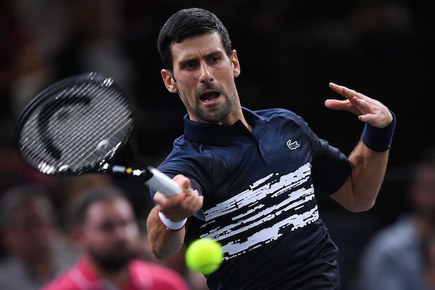 Serbia's Novak Djokovic returns the ball to Britain's Kyle Edmund during their men's singles tennis match on day four of the ATP World Tour Masters 1000 - Rolex Paris Masters - indoor tennis tournament at The AccorHotels Arena in Paris on October 31, 2019. (Photo by Christophe ARCHAMBAULT / AFP) (Photo by CHRISTOPHE ARCHAMBAULT/AFP via Getty Images)