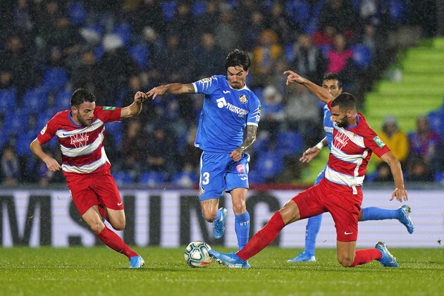GETAFE, SPAIN - OCTOBER 31: Jasen of Getafe CF battle for the ball with Maxime Ganalons of Granada CF during the La Liga match between Getafe CF and Granada CF at Coliseum Alfonso Perez on October 31, 2019 in Getafe, Spain. (Photo by Quality Sport Images/Getty Images)