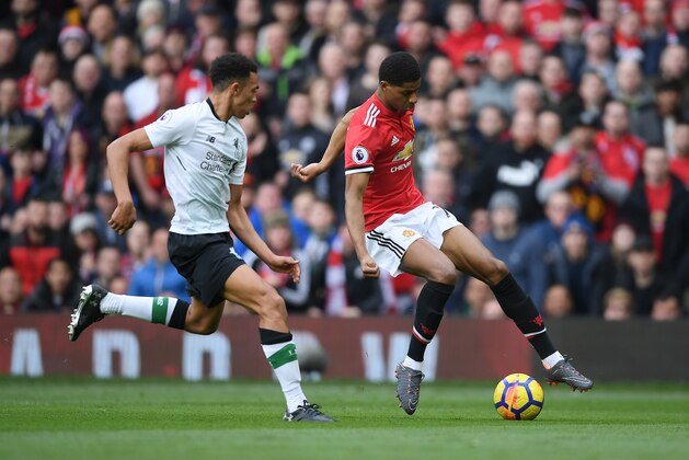 MANCHESTER, ENGLAND - MARCH 10: Marcus Rashford of Manchester United turns Alexander-Arnold Trent of Liverpool on his way to scoring the opening goal during the Premier League match between Manchester United and Liverpool at Old Trafford on March 10, 2018 in Manchester, England.  (Photo by Laurence Griffiths/Getty Images)
