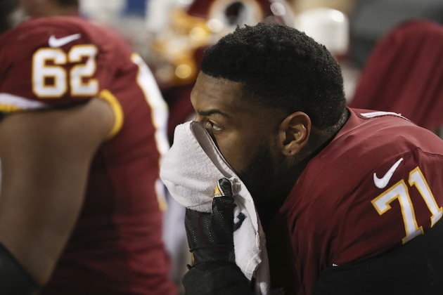 Washington Redskins offensive tackle Trent Williams sits on the sideline in the final moments of an NFL football game against the Philadelphia Eagles, Sunday, Dec. 30, 2018, in Landover, Md. The Eagles defeated the Redskins 24-0. (AP Photo/Andrew Harnik)