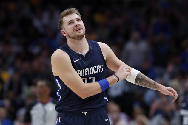 Dallas Mavericks' Dwight Powell gestures with his arms after a foul was called against the Mavericks during the first half of an NBA basketball game against the Los Angeles Lakers in Dallas, Friday, Nov. 1, 2019. (AP Photo/Tony Gutierrez)