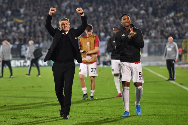 Manchester United's Norwegian manager Ole Gunnar Solskjaer (L) and Manchester United's French striker Anthony Martial gesture at the final whistle during the UEFA Europa league group L football match between Partizan Belgrade and Manchester United at the Partizan stadium in Belgrade on October 24, 2019. - Manchester United beat Partizan Belkgrade 1 - 0. (Photo by ANDREJ ISAKOVIC / AFP) (Photo by ANDREJ ISAKOVIC/AFP via Getty Images)