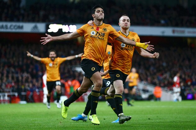 LONDON, ENGLAND - NOVEMBER 02:  Raul Jimenez of Wolverhampton Wanderers celebrates with teammate Diogo Jota after scoring his team's first goal during the Premier League match between Arsenal FC and Wolverhampton Wanderers at Emirates Stadium on November 02, 2019 in London, United Kingdom. (Photo by Jordan Mansfield/Getty Images)