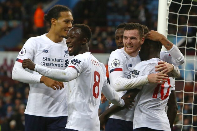 Liverpool's Senegalese striker Sadio Mane (R) celebrates with teammates after scoring his team's second goal during the English Premier League football match between Aston Villa and Liverpool at Villa Park in Birmingham, central England on November 2, 2019. (Photo by GEOFF CADDICK / AFP) / RESTRICTED TO EDITORIAL USE. No use with unauthorized audio, video, data, fixture lists, club/league logos or 'live' services. Online in-match use limited to 120 images. An additional 40 images may be used in extra time. No video emulation. Social media in-match use limited to 120 images. An additional 40 images may be used in extra time. No use in betting publications, games or single club/league/player publications. /  (Photo by GEOFF CADDICK/AFP via Getty Images)