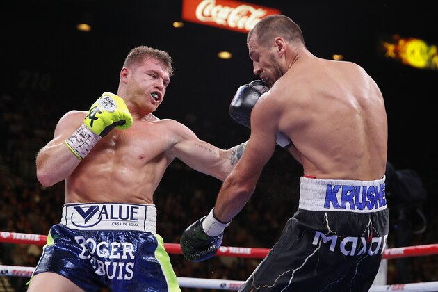 Canelo Alvarez left, lands a punch against Sergey Kovalev, Saturday, Nov. 2, 2019, in Las Vegas (AP Photo/Isaac Brekken)