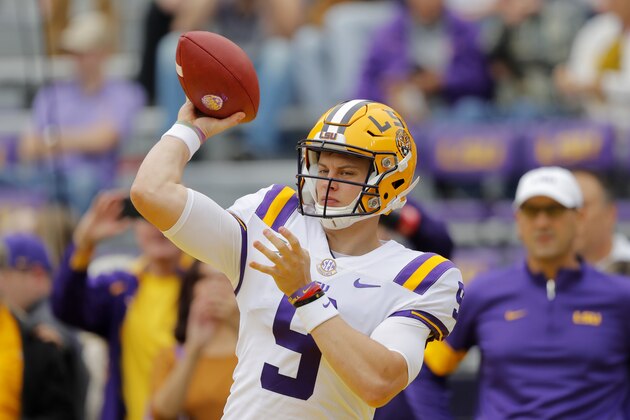LSU quarterback Joe Burrow (9) warms up before an NCAA college football game against the Auburn in Baton Rouge, La., Saturday, Oct. 26, 2019. (AP Photo/Gerald Herbert)