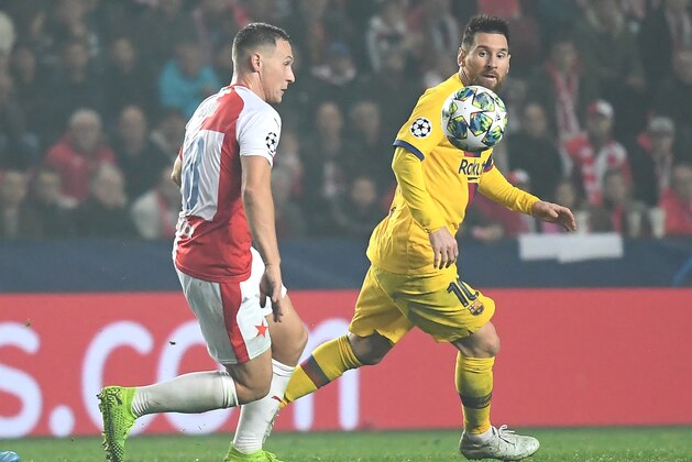Slavia's Czech defender Jan Boril (L) and Barcelona's Argentinian forward Lionel Messi vie for the ball during the UEFA Champions League football match between SK Slavia Prague and FC Barcelona in Prague, Czech Republic on October 23, 2019. (Photo by JOE KLAMAR / AFP) (Photo by JOE KLAMAR/AFP via Getty Images)