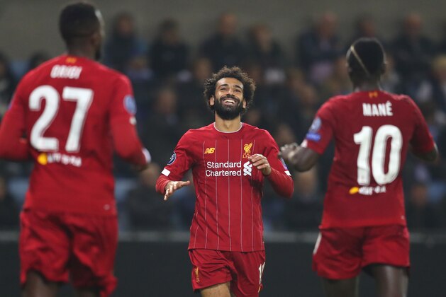 GENK, BELGIUM - OCTOBER 23: Mohamed Salah of Liverpool celebrates with teammate Sadio Mane after scoring his team's fourth goal during the UEFA Champions League group E match between KRC Genk and Liverpool FC at Luminus Arena on October 23, 2019 in Genk, Belgium. (Photo by Catherine Ivill/Getty Images)
