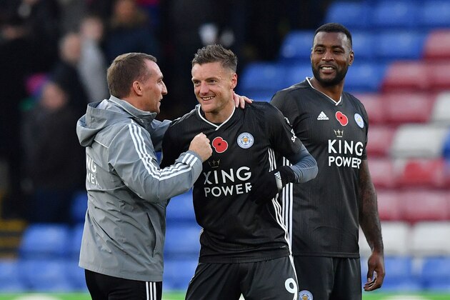 Leicester City's Northern Irish manager Brendan Rodgers (L) congratulates Leicester City's English striker Jamie Vardy (C) following the English Premier League football match between Crystal Palace and Leicester City at Selhurst Park in south London on November 3, 2019. - Leicester won the match 2-0. (Photo by Ben STANSALL / AFP) / RESTRICTED TO EDITORIAL USE. No use with unauthorized audio, video, data, fixture lists, club/league logos or 'live' services. Online in-match use limited to 120 images. An additional 40 images may be used in extra time. No video emulation. Social media in-match use limited to 120 images. An additional 40 images may be used in extra time. No use in betting publications, games or single club/league/player publications. /  (Photo by BEN STANSALL/AFP via Getty Images)