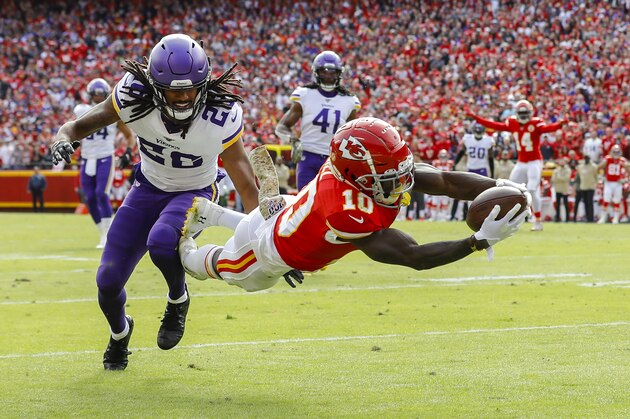 KANSAS CITY, MO - NOVEMBER 03: Tyreek Hill #10 of the Kansas City Chiefs leaps to the goal line on a 40-yard touchdown pass behind the defense of Trae Waynes #26 of the Minnesota Vikings in the first quarter at Arrowhead Stadium on November 3, 2019 in Kansas City, Missouri. (Photo by David Eulitt/Getty Images)