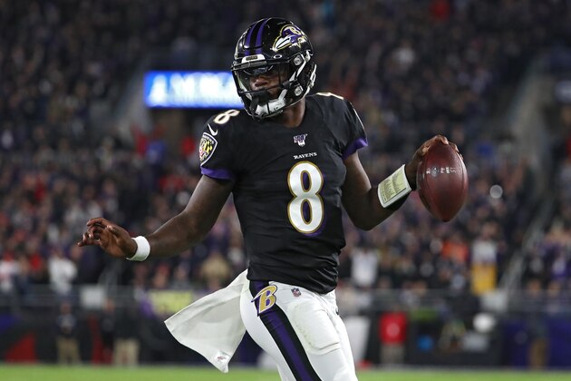 BALTIMORE, MARYLAND - NOVEMBER 03: Quarterback Lamar Jackson #8 of the Baltimore Ravens scores a first quarter touchdown  against the New England Patriots at M&T Bank Stadium on November 3, 2019 in Baltimore, Maryland. (Photo by Todd Olszewski/Getty Images)