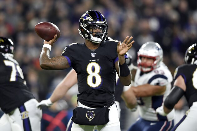 Baltimore Ravens quarterback Lamar Jackson throws a pass against the New England Patriots during the first half of an NFL football game, Sunday, Nov. 3, 2019, in Baltimore. (AP Photo/Gail Burton)