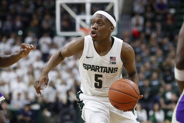 Michigan State guard Cassius Winston brings the ball up court during the second half of an NCAA college exhibition basketball game against Albion, Tuesday, Oct. 29, 2019, in East Lansing, Mich. (AP Photo/Carlos Osorio)