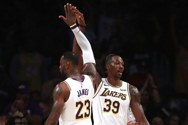 LOS ANGELES, CALIFORNIA - OCTOBER 27:  LeBron James #23 celebrates with Dwight Howard #39 of the Los Angeles Lakers during the second half of a game  at Staples Center on October 27, 2019 in Los Angeles, California. (Photo by Sean M. Haffey/Getty Images)