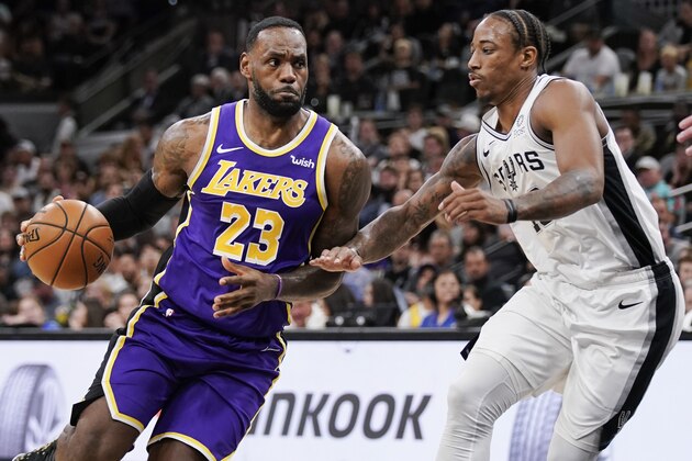 Los Angeles Lakers' LeBron James (23) drives against San Antonio Spurs' DeMar DeRozan during the first half of an NBA basketball game, Sunday, Nov. 3, 2019, in San Antonio. Los Angeles won 103-96. (AP Photo/Darren Abate)