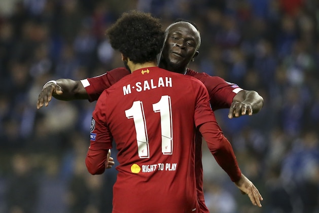 GENK, BELGIUM - OCTOBER 23: Mohamed Salah of Liverpool celebrates his goal with Sadio Mane during the UEFA Champions League group E match between KRC Genk and Liverpool FC at Luminus Arena on October 23, 2019 in Genk, Belgium. (Photo by Jean Catuffe/Getty Images)