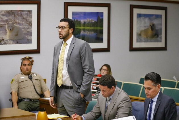 FILE - In this June 14, 2019 file photo, former NFL football player Kellen Winslow Jr, standing second from left, speaks during a court hearing Friday, June 14, 2019 in Vista, Calif. Winslow is returning to court five months after being convicted of raping a homeless woman to be retried on rape charges involving other women. The prosecution and defense plan to give their opening statements Monday, Nov. 4. (Howard Lipin/The San Diego Union-Tribune via AP, Pool, File)