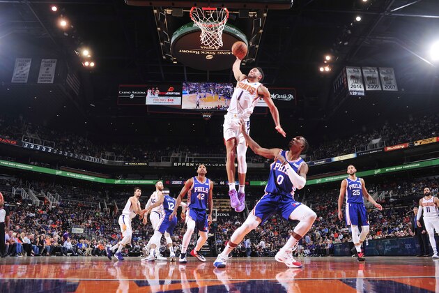 PHOENIX, AZ - NOVEMBER 4: Devin Booker #1 of the Phoenix Suns goes up for against a dunk against the Philadelphia 76ers on November 4, 2019 at Talking Stick Resort Arena in Phoenix, Arizona. NOTE TO USER: User expressly acknowledges and agrees that, by downloading and or using this photograph, user is consenting to the terms and conditions of the Getty Images License Agreement. Mandatory Copyright Notice: Copyright 2019 NBAE (Photo by Barry Gossage/NBAE via Getty Images)