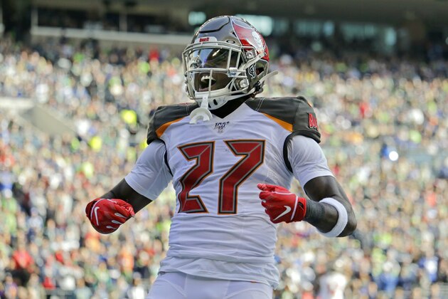 Tampa Bay Buccaneers running back Ronald Jones celebrates after scoring a touchdown against the Seattle Seahawks during the first half of an NFL football game, Sunday, Nov. 3, 2019, in Seattle. (AP Photo/John Froschauer)