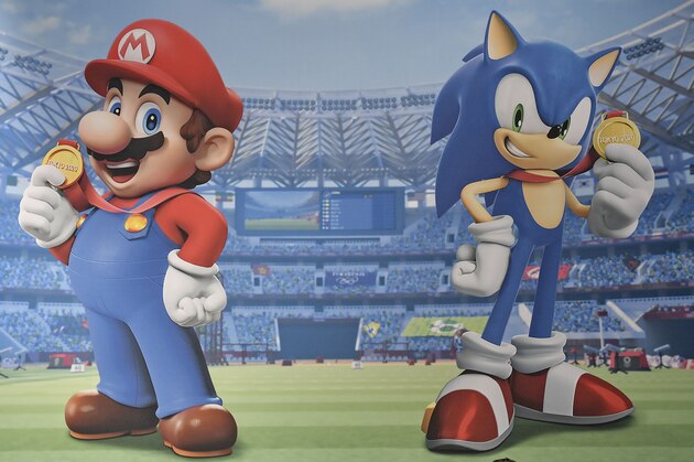 People play the latest Super Mario & Sonic at the Tokyo Olympic Games video game at the Gamescom in Cologne, Germany, Tuesday, Aug. 20, 2019. Hundreds of thousands will check out the latest video games this week at the biggest event in the gaming industry. (AP Photo/Martin Meissner)