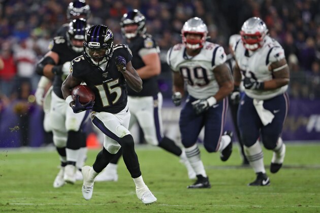 BALTIMORE, MARYLAND - NOVEMBER 03: Wide receiver Marquise Brown #15 of the Baltimore Ravens rushes after catching a pass against the New England Patriots during the third quarter at M&T Bank Stadium on November 3, 2019 in Baltimore, Maryland. (Photo by Todd Olszewski/Getty Images)