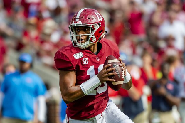 Alabama quarterback Tua Tagovailoa (13) rolls out against Mississippi during the first half of an NCAA college football game, Saturday, Sept. 28, 2019, in Tuscaloosa, Ala. (AP Photo/Vasha Hunt)