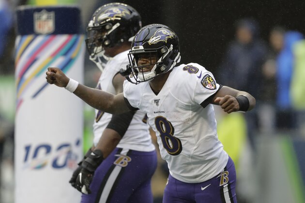 Baltimore Ravens quarterback Lamar Jackson (8) celebrates after he scored a touchdown against the Seattle Seahawks during the second half of an NFL football game, Sunday, Oct. 20, 2019, in Seattle. (AP Photo/John Froschauer)