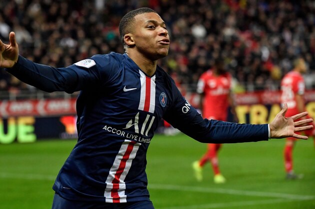 Paris Saint-Germain's French forward Kylian Mbappe celebrates after scoring a goal during the French L1 football match between Dijon Football Cote-d'Or (DFCO) and Paris Saint-Germain (PSG) on November 1, 2019, at the Gaston Gerard stadium in Dijon. (Photo by Philippe DESMAZES / AFP) (Photo by PHILIPPE DESMAZES/AFP via Getty Images)