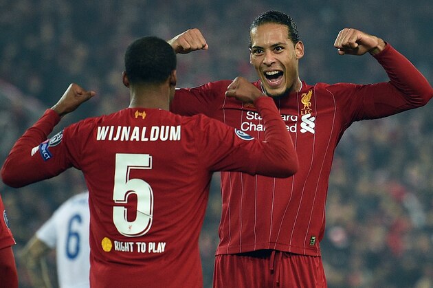 Liverpool's Dutch midfielder Georginio Wijnaldum (L) celebrates scoring with Liverpool's Dutch defender Virgil van Dijk during the UEFA Champions League group E football match between Liverpool and RC Genk at Anfield in Liverpool, north west England on November 5, 2019. (Photo by Oli SCARFF / AFP) (Photo by OLI SCARFF/AFP via Getty Images)
