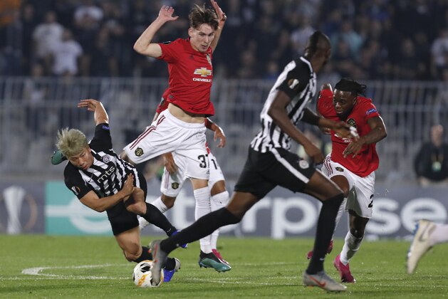 Partizan's Takuma Asano, left, challenges for the ball with Manchester United's James Garner uring the Europa League group L soccer match between Partizan Belgrade and Manchester United at the Partizan stadium in Belgrade, Serbia, Thursday, Oct. 24, 2019. (AP Photo/Darko Vojinovic) Partizan's Takuma Asano, left, challenges for the ball with Manchester United's James Garner uring the Europa League group L soccer match between Partizan Belgrade and Manchester United at the Partizan stadium in Belgrade, Serbia, Thursday, Oct. 24, 2019. (AP Photo/Darko Vojinovic)
