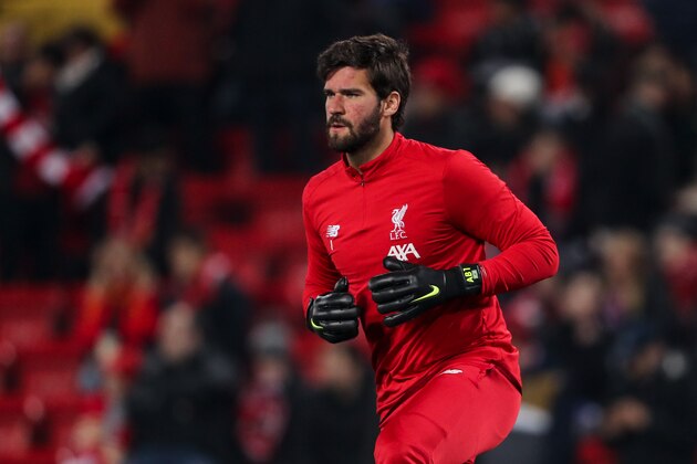 LIVERPOOL, ENGLAND - NOVEMBER 05: Alisson Becker of Liverpool warms up prior to the UEFA Champions League group E match between Liverpool FC and KRC Genk at Anfield on November 5, 2019 in Liverpool, United Kingdom. (Photo by Matthew Ashton - AMA/Getty Images)