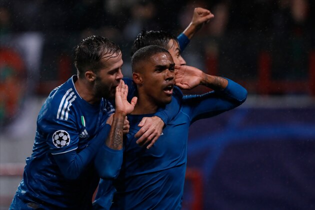 MOSCOW, RUSSIA - NOVEMBER 06: Douglas Costa (C) of Juventus celebrates his goal with Miralem Pjanic (L) and Paulo Dybala during the UEFA Champions League group D match between Lokomotiv Moskva and Juventus FC at RZD Arena on November 6, 2019 in Moscow, Russia. (Photo by Mike Kireev/MB Media/Getty Images)