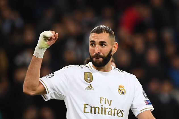 Real Madrid's French forward Karim Benzema celebrates after scoring during the UEFA Champions League Group A football match between Real Madrid and Galatasaray at the Santiago Bernabeu stadium in Madrid, on November 6, 2019. (Photo by GABRIEL BOUYS / AFP) (Photo by GABRIEL BOUYS/AFP via Getty Images)