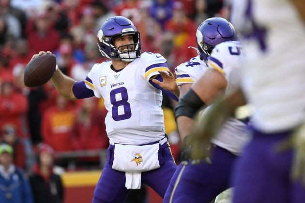 Minnesota Vikings quarterback Kirk Cousins (8) throws a touchdown pass to tight end Kyle Rudolph during the second half of an NFL football game against the Kansas City Chiefs in Kansas City, Mo., Sunday, Nov. 3, 2019. (AP Photo/Reed Hoffmann)