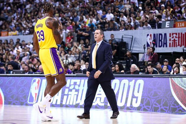 SHENZHEN, CHINA - OCTOBER 12: Head coach Frank Vogel of the Los Angeles Lakers speaks to #39 Dwight Howard during the match against the Brooklyn Nets during a preseason game as part of 2019 NBA Global Games China at Shenzhen Universiade Center on October 12, 2019 in Shenzhen, Guangdong, China. (Photo by Zhong Zhi/Getty Images)