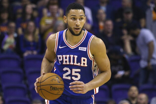 Philadelphia 76ers guard Ben Simmons dribbles the ball against the Phoenix Suns during the first half of an NBA basketball game Monday, Nov. 4, 2019, in Phoenix. (AP Photo/Ross D. Franklin)