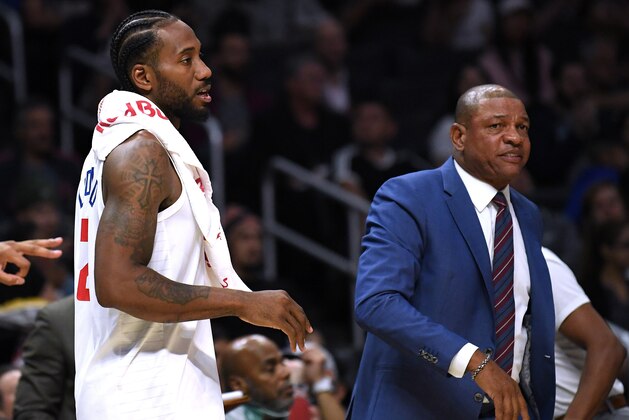 LOS ANGELES, CALIFORNIA - OCTOBER 10:  Kawhi Leonard #2 and Doc Rivers of the LA Clippers during a 111-91 Denver Nuggets preseason win at Staples Center on October 10, 2019 in Los Angeles, California. (Photo by Harry How/Getty Images)