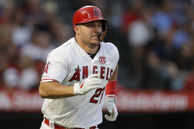 Los Angeles Angels' Mike Trout runs to first after a RBI-single against the Boston Red Sox during the second inning of a baseball game in Anaheim, Calif., Saturday, Aug. 31, 2019. (AP Photo/Chris Carlson)