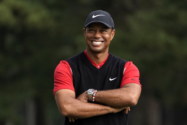 Tiger Woods of the United States smiles during a winner's ceremony after winning the Zozo Championship PGA Tour at the Accordia Golf Narashino country club in Inzai, east of Tokyo, Japan, Monday, Oct. 28, 2019. (AP Photo/Lee Jin-man)