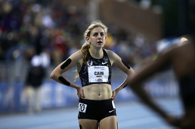 Mary Cain walks off the track after competing in the women's special 1500-meter run at the Drake Relays athletics meet, Friday, April 29, 2016, in Des Moines, Iowa. (AP Photo/Charlie Neibergall)