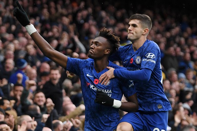 LONDON, ENGLAND - NOVEMBER 09: Tammy Abraham of Chelsea celebrates after scoring his team's first goal with teammate Christian Pulisic during the Premier League match between Chelsea FC and Crystal Palace at Stamford Bridge on November 09, 2019 in London, United Kingdom. (Photo by Mike Hewitt/Getty Images)