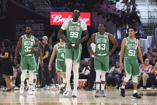 Boston Celtics' Tacko Fall (99) leads Semi Ojeleye (37), Carsen Edwards (4), Javonte Green (43) and Tremont Waters (51) back onto the floor after a timeout against the Cleveland Cavaliers in the first half of an NBA preseason basketball game, Tuesday, Oct. 15, 2019, in Cleveland. (AP Photo/Ron Schwane)
