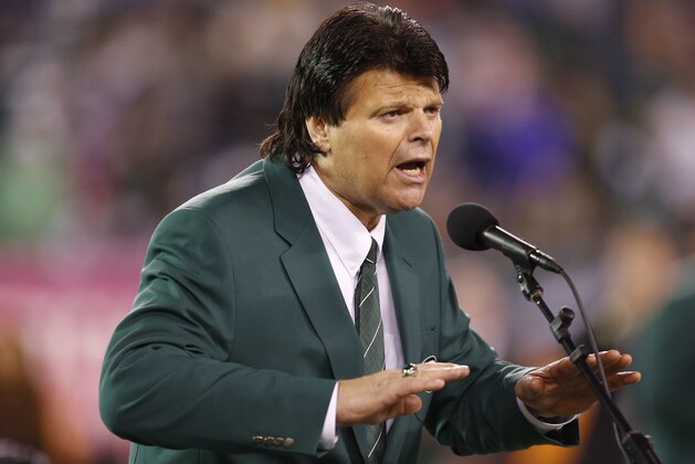 FILE - In this Oct. 8, 2012, file photo, former New York Jets defensive end Mark Gastineau speaks during halftime of an NFL football game between the Jets and the Houston Texans in East Rutherford, N.J.  Gastineau made an emotional plea to NFL Commissioner Roger Goodell to help former players like him who are dealing with football-related health issues. Gastineau says during a radio interview Thursday night, March 8, 2018, that he wants ailing players to be “treated right” by the NFL. The 61-year-old Gastineau announced last year that he was diagnosed with dementia, Alzheimer's disease and Parkinson's disease. (AP Photo/Julio Cortez, File)