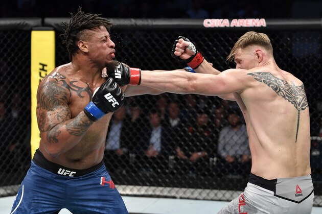 MOSCOW, RUSSIA - NOVEMBER 09:  (R-L) Alexander Volkov of Russia punches Greg Hardy in their heavyweight bout during the UFC Fight Night event at CSKA Arena on November 09, 2019 in Moscow, Russia. (Photo by Jeff Bottari/Zuffa LLC via Getty Images)