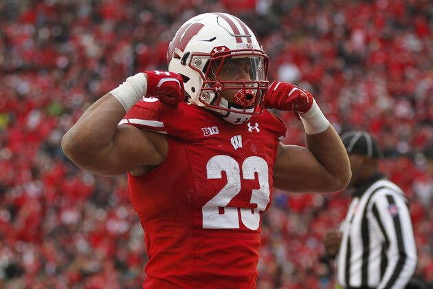 Wisconsin running back Jonathan Taylor celebrates a touchdown against Michigan State during the second half of an NCAA college football game Saturday, Oct. 12, 2019, in Madison, Wis. Wisconsin won 38-0. (AP Photo/Andy Manis) Wisconsin running back Jonathan Taylor celebrates a touchdown against Michigan State during the second half of an NCAA college football game Saturday, Oct. 12, 2019, in Madison, Wis. Wisconsin won 38-0. (AP Photo/Andy Manis)